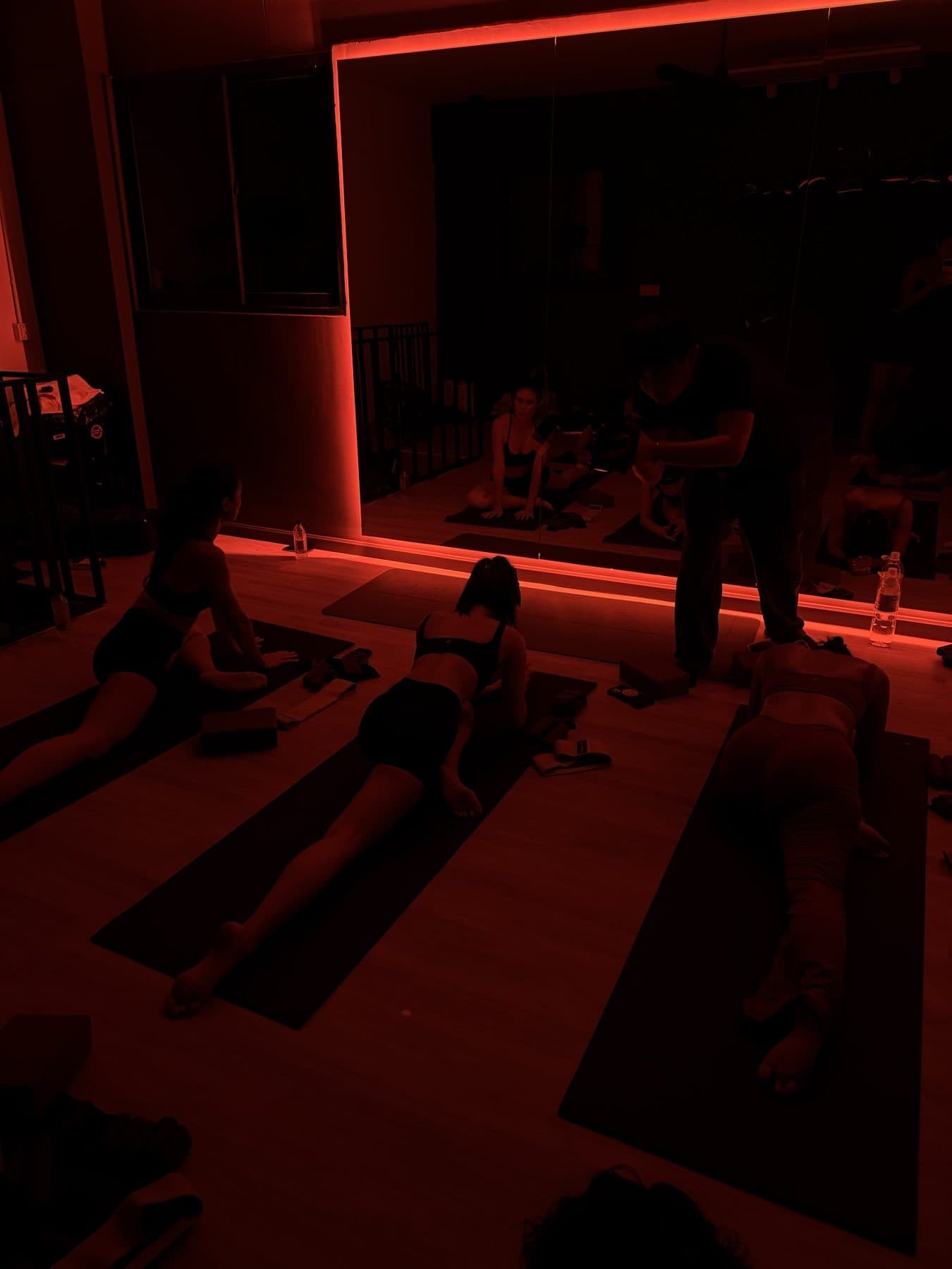 The dark, red-lit studio room